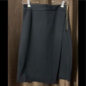 NWT black faux wrap skirt. Size 6.